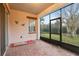 Bright and airy screened porch with brick flooring at 2451 Datura Loop, St Cloud, FL 34772