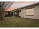 Backyard view of the screened porch at dusk at 2451 Datura Loop, St Cloud, FL 34772