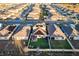 An aerial view showcasing a vibrant residential neighborhood with well-maintained homes and green spaces, creating an inviting atmosphere at 2778 Sunkissed Dr, St Cloud, FL 34771