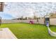 Spacious backyard with turf, playset, and playhouse at 2778 Sunkissed Dr, St Cloud, FL 34771