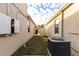 Exterior backyard view including a hot water tank and a Carrier AC unit at 2778 Sunkissed Dr, St Cloud, FL 34771