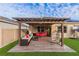 Covered patio features wicker furniture and a hammock at 2778 Sunkissed Dr, St Cloud, FL 34771