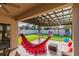 Relaxing backyard patio with pergola, hammock, and seating at 2778 Sunkissed Dr, St Cloud, FL 34771