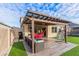 Relaxing patio area with pergola and outdoor seating at 2778 Sunkissed Dr, St Cloud, FL 34771