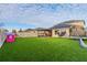 Spacious backyard with artificial grass and play area at 2778 Sunkissed Dr, St Cloud, FL 34771