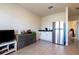 Finished basement with a kitchenette and mini-fridge at 2778 Sunkissed Dr, St Cloud, FL 34771