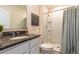 Clean bathroom with granite countertop, shower, and toilet at 2778 Sunkissed Dr, St Cloud, FL 34771