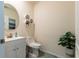 Small bathroom with white vanity and a modern toilet at 2778 Sunkissed Dr, St Cloud, FL 34771