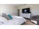 Main bedroom with a comfy bed and large TV at 2778 Sunkissed Dr, St Cloud, FL 34771