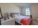 Spacious bedroom with a comfortable bed and large window at 2778 Sunkissed Dr, St Cloud, FL 34771