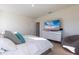 Spacious bedroom with large bed, dresser, and TV at 2778 Sunkissed Dr, St Cloud, FL 34771