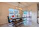 Bright dining area with table, bench, and sliding glass doors at 2778 Sunkissed Dr, St Cloud, FL 34771