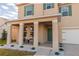 Attractive two-story home with a covered front porch and manicured landscaping at 2778 Sunkissed Dr, St Cloud, FL 34771