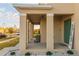 Welcoming front porch with decorative columns and charming 'Welcome Home' sign at 2778 Sunkissed Dr, St Cloud, FL 34771