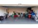 Spacious, clutter-filled garage with epoxy flooring and ample storage options; 2178 address above at 2778 Sunkissed Dr, St Cloud, FL 34771