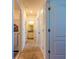 Clean hallway with neutral carpeting and access to rooms at 2778 Sunkissed Dr, St Cloud, FL 34771