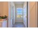 Bright hallway with tile flooring and access to other rooms at 2778 Sunkissed Dr, St Cloud, FL 34771