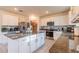 Spacious kitchen with granite countertops, stainless steel appliances, and white cabinets at 2778 Sunkissed Dr, St Cloud, FL 34771