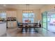 Kitchen with island, white cabinets, and breakfast nook at 2778 Sunkissed Dr, St Cloud, FL 34771