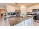 Island kitchen with granite countertops and stainless steel appliances at 2778 Sunkissed Dr, St Cloud, FL 34771