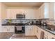 Modern kitchen with granite countertops and stainless steel appliances at 2778 Sunkissed Dr, St Cloud, FL 34771