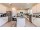 Eat-in kitchen with island, granite countertops, and stainless steel appliances at 2778 Sunkissed Dr, St Cloud, FL 34771