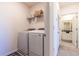 Laundry room with washer, dryer, and extra storage at 2778 Sunkissed Dr, St Cloud, FL 34771