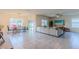 Living room with sectional sofa, large TV, and ceiling fan at 2778 Sunkissed Dr, St Cloud, FL 34771