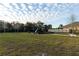 Community playground with slide and play structure surrounded by a large grassy area at 2778 Sunkissed Dr, St Cloud, FL 34771
