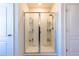 Clean shower with glass enclosure and built-in shelves at 2778 Sunkissed Dr, St Cloud, FL 34771