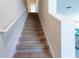 Carpeted staircase leading to the upper level at 2778 Sunkissed Dr, St Cloud, FL 34771