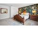 Nicely staged bedroom with a statement wallpaper and an eye-catching, decorative mirror at 2818 Roccella Ct, Kissimmee, FL 34747