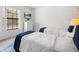 Well-lit bedroom featuring two twin beds, large window and minimalistic decor at 2818 Roccella Ct, Kissimmee, FL 34747