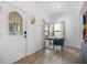 Inviting entryway with decorative door, wood floors, and a view of the adjacent office area at 2818 Roccella Ct, Kissimmee, FL 34747