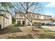 Charming two-story home with a well-maintained front yard, mature tree, and a two-car garage at 2818 Roccella Ct, Kissimmee, FL 34747