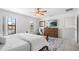 Bright main bedroom featuring a large window and neutral color palette at 2818 Roccella Ct, Kissimmee, FL 34747