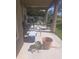 Covered patio with seating and a small grill at 2889 Paige Dr, Kissimmee, FL 34741