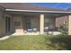 Covered patio with seating area and grill at 2889 Paige Dr, Kissimmee, FL 34741