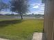 Backyard with pond view and green lawn at 2889 Paige Dr, Kissimmee, FL 34741