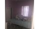 Small bedroom with a double bed and pink walls at 2889 Paige Dr, Kissimmee, FL 34741