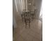 Small breakfast nook with a glass-top table and four chairs at 2889 Paige Dr, Kissimmee, FL 34741