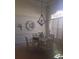Dining room with chandelier and glass-top dining table at 2889 Paige Dr, Kissimmee, FL 34741