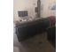 Living room with sectional sofa and entertainment center at 2889 Paige Dr, Kissimmee, FL 34741