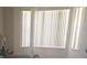 Living room with large windows and vertical blinds at 2889 Paige Dr, Kissimmee, FL 34741