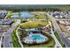 Aerial view of community pool, park, and residential homes at 3055 Prospect Trl, St Cloud, FL 34771