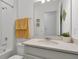 Bathroom with white vanity, stone countertop, and subway tile shower at 3055 Prospect Trl, St Cloud, FL 34771