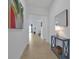 Bright and airy entryway with tile flooring and a view of the living room at 3055 Prospect Trl, St Cloud, FL 34771