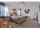 Spacious main bedroom with ceiling fan, carpeted floor, and large bed at 3055 Prospect Trl, St Cloud, FL 34771