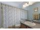 Bathroom with tiled shower-tub, tile floor, modern vanity and medicine cabinet at 3219 Sawgrass Creek Cir, St Cloud, FL 34772