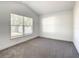 Bedroom with neutral carpet and a large window at 438 Jay Ct, Kissimmee, FL 34759